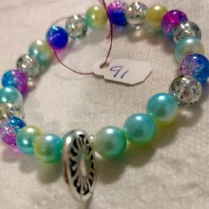 Artemis's Gems custom-made beaded bracelet with metal sun charm